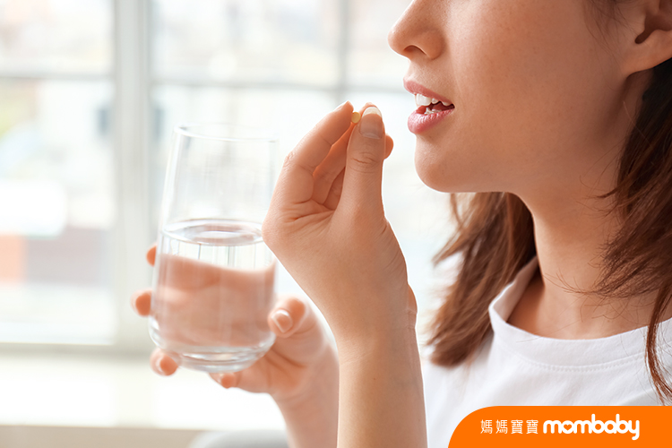 Young,Woman,Taking,Pills,At,Home